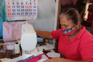 PLDT 3: Hard work in action with one of the sewing machines donated by PLDT. (Photo supplied) 