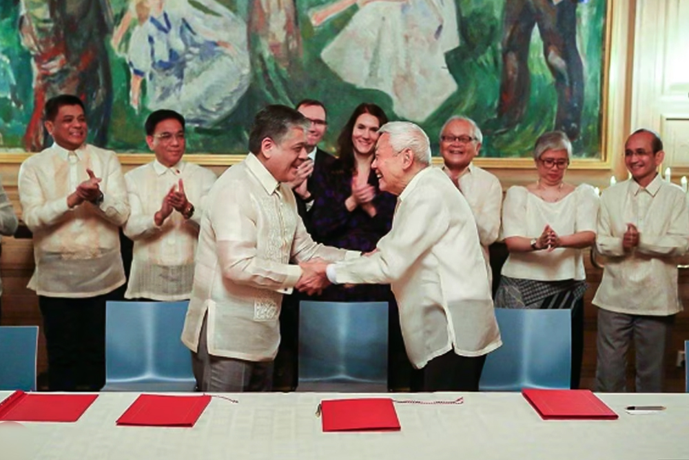 Government officials and the National Democratic Front of the Philippines agree to a "principled and peaceful resolution of the armed conflict," the Palace said.