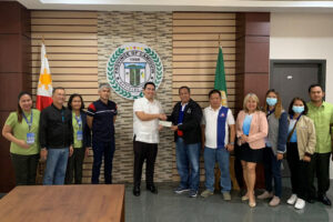 Camiguin Gov. Xavier Jesus Romualdo (5th from left) receives the check worth P16 million from DOLE-10 as salaries of the province’s 3,990 disadvantaged beneficiaries. (Supplied photo)