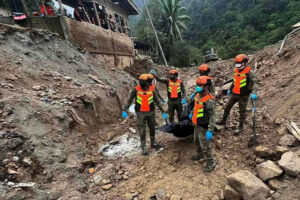 Army rescuers and government responders recover another body at the landslide ground zero in Barangay Masara, Davao de Oro on Feb. 12, 2024. (Philippine Army/Facebook)