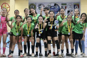 ‘AIM FOR THE SKY’. The Lumbia Raptors Football Club Girls team with their champion coach Mikylla Andrea Albarico (standing left in pink uniform) celebrates after winning the Girls 18 title in the FFF Girls Power Futsal Cup last Jan. 28 at the Bulua National High School gym. (Standing left to right) Jamz Esteban, Alessandra Rizardo, Anajean Bradley, Mary Rose Pagalan, Mary Love Lacar, Devine Parojinog, (squating left to right) Althea Palma, Precious Exequil, Sarah Caballero, Xennah Delima, Kate Albarico, Chelsea Selada (Photo by John Wayne Obando)