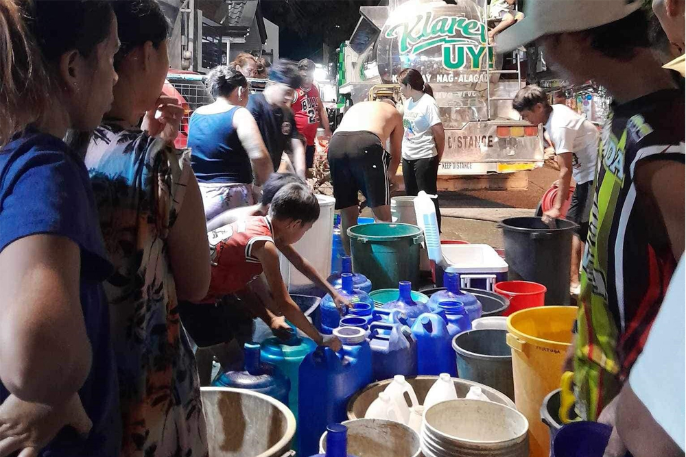 1. Water rationing at the relocation site in Calaanan, Barangay Canitoan, March 3, 2024. [Photo by Aicy Soriano]