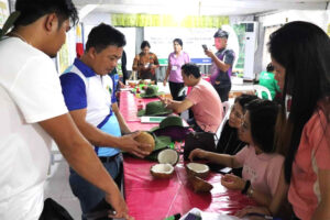 As part of their hands-on demo and fieldwork, the training participants inspected and studied the kinds of coconut varieties available at the Buhian Diversified Farm in Initao, Misamis Oriental. (Photo courtesy of ATI-10)