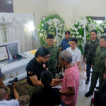 VALOR. Department of the Interior and Local Government Secretary Benjamin Abalos Jr. and PNP chief Gen. Rommel Francisco Marbil (center) visit the wake of Pat. Ian Valdez at the St. Peter Memorial Chapel, Barangay Divisoria, Zamboanga City on Thursday (May 30, 2024). Valdez was killed in a counter-terrorism operation in Tawi-Tawi that led to the death of ASG sub-leader Udon Hasim, while his two colleagues, Master Sergeants Mohammad Lee Aharul and Alberto Olbis, were wounded. (Photo courtesy of PNP)