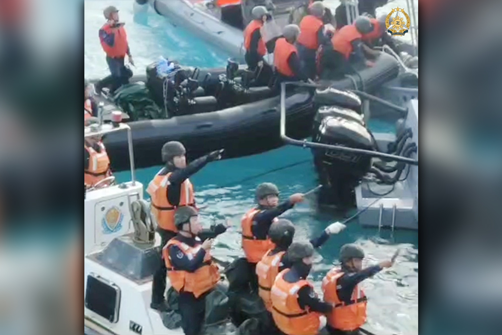 AGGRESSIVE. China Coast Guard personnel brandish bladed and pointed weapons on Filipino troops carrying out a humanitarian rotation and resupply mission to the BRP Sierra Madre in Ayungin Shoal on June 17, 2024. The Armed Forces of the Philippines on Thursday (June 20) said Beijing's increased aggression will not deter Manila from carrying out rotation and resupply missions to its troops in the West Philippine Sea. (Photo courtesy of the AFP)