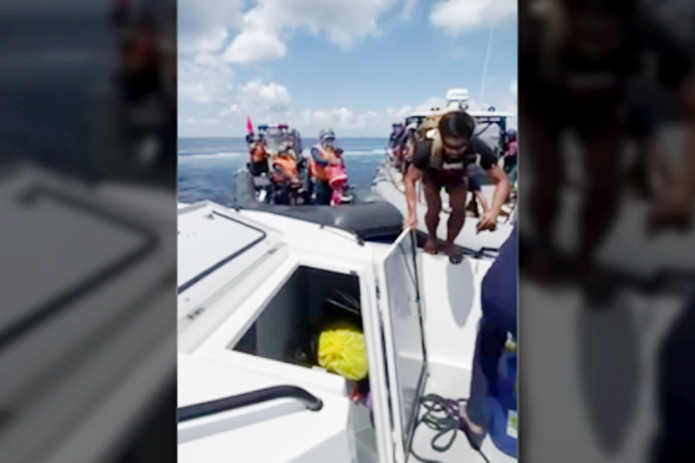 RAMMING. Filipino soldiers jump out of the way of the ramming of a China Coast Guard boat during a medical evacuation in Ayungin Shoal in the West Philippine Sea on May 19, 2024. National Task Force for the WPS spokesperson, Philippine Coast Guard Commodore Jay Tarriela called such moves "barbaric and inhumane." (Screen capture of PCG video)